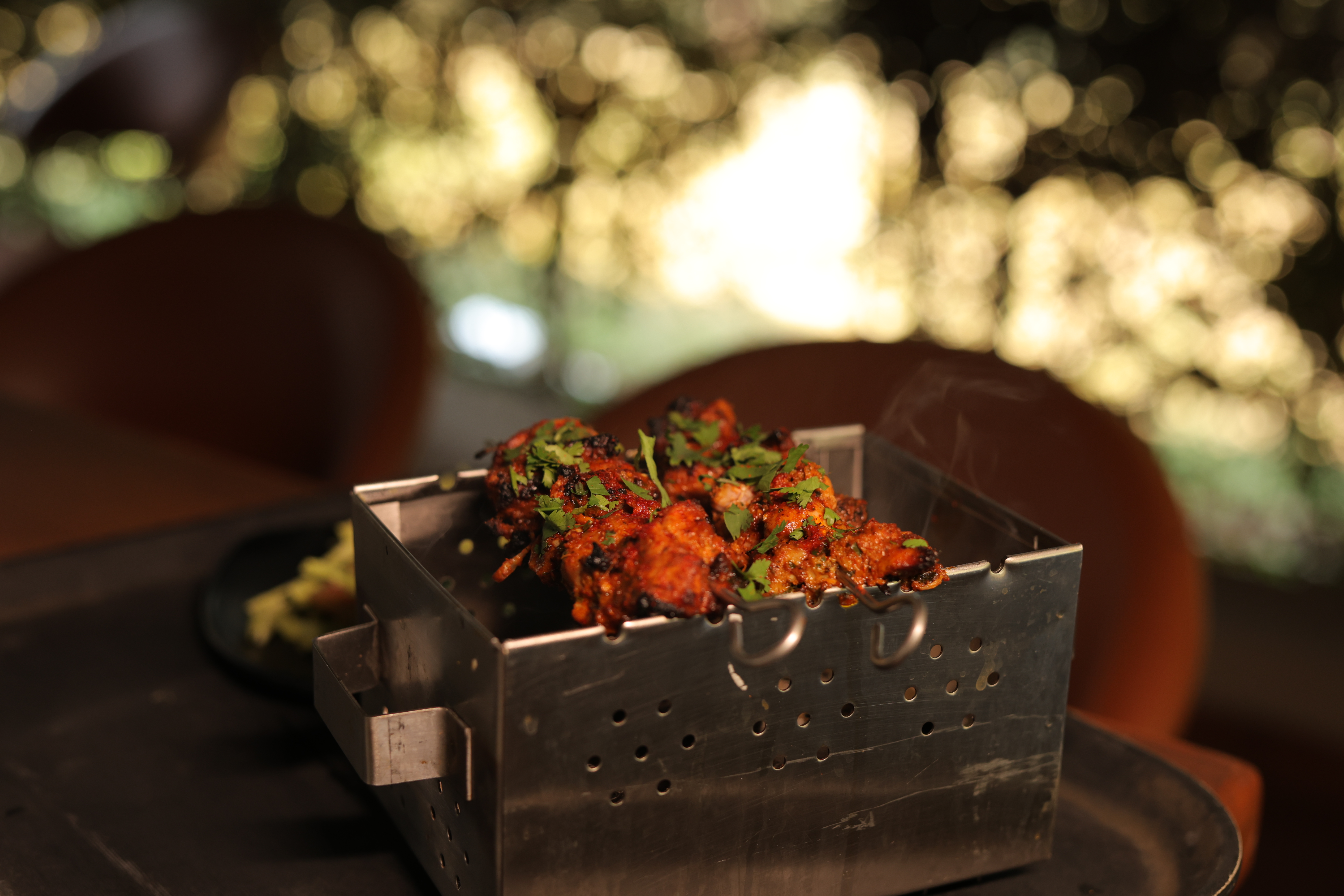 Smoky chicken tikka in signature presentation box at Jatra Countryside
