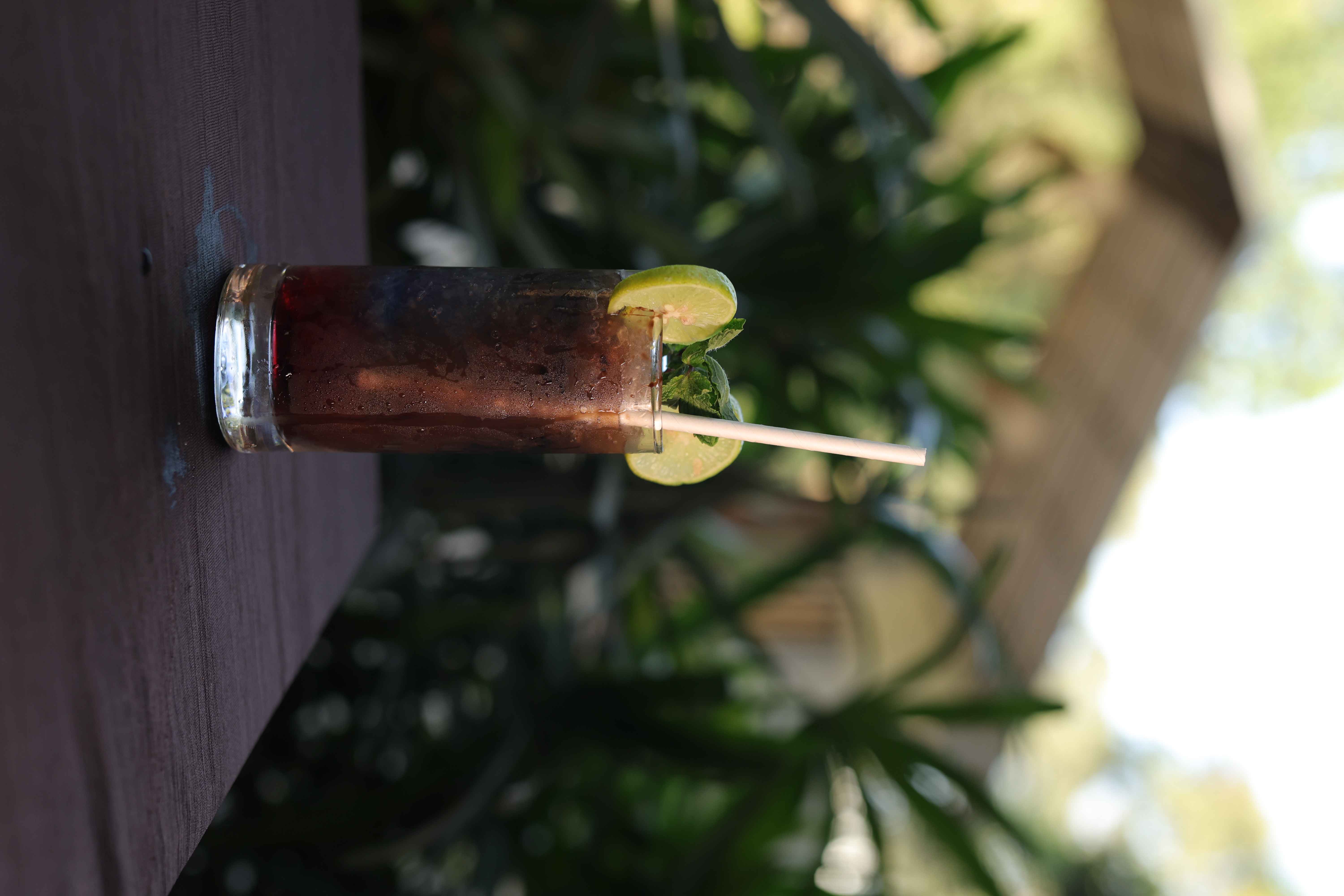 Iced dark mocktail with lime and mint at Jatra Countryside